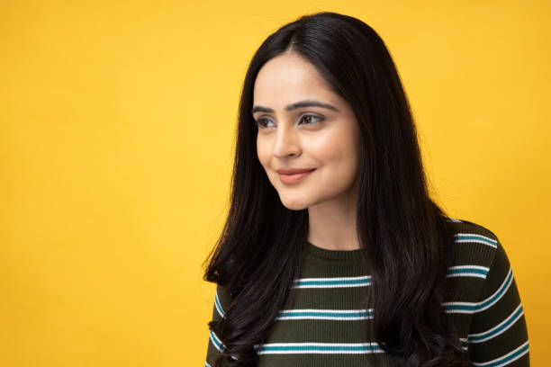 Photo of young girl wearing-t-shirt-isolated-yellow-background